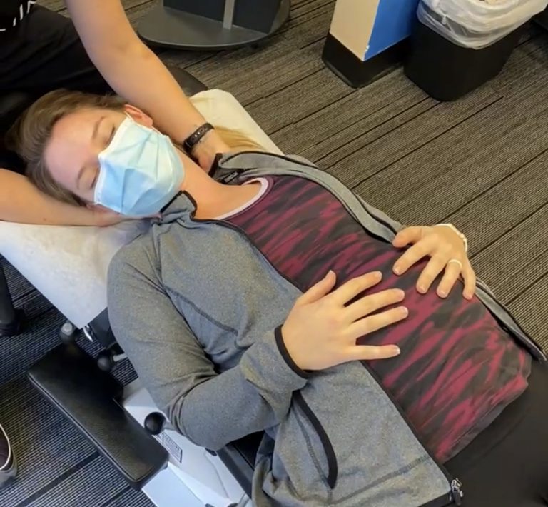 chiropractor treating pregnant new mom to be